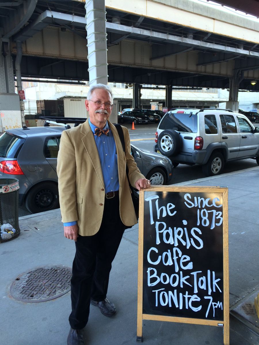 Photo of James Lindgren in front of the Paris Cafe the day he had a book reception there